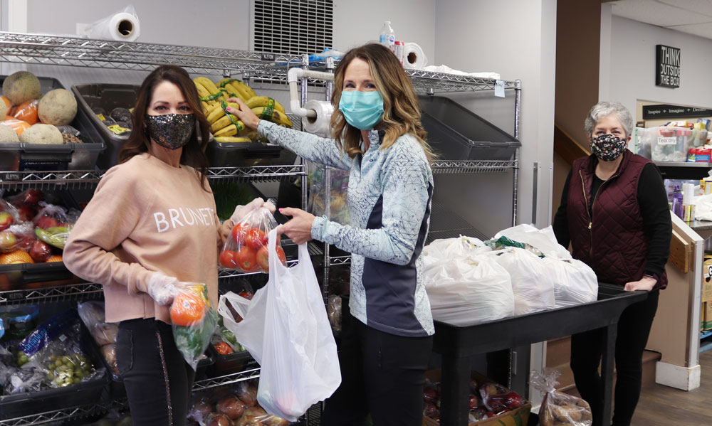 Volunteers building hampers